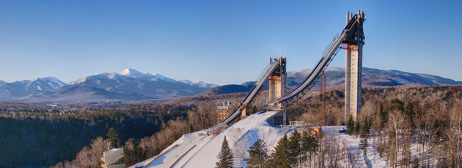 Olympic Jumping Complex towers with Adirondack Mountains in the background
