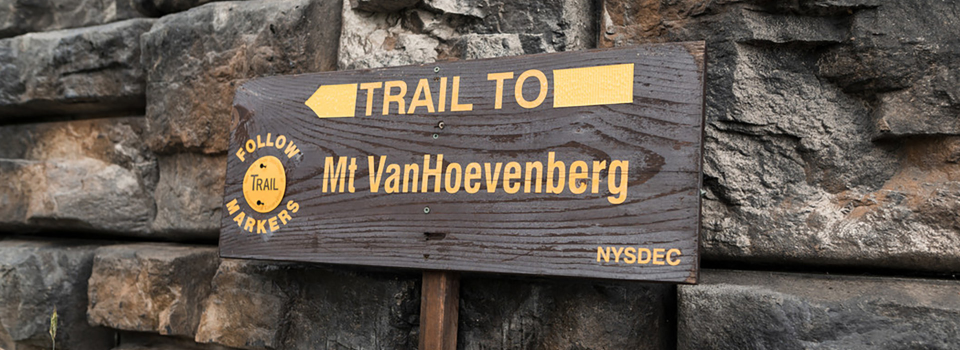 Wooden sign on the East Mountain Trail pointing the direction to the Mt Van Hoevenberg summit
