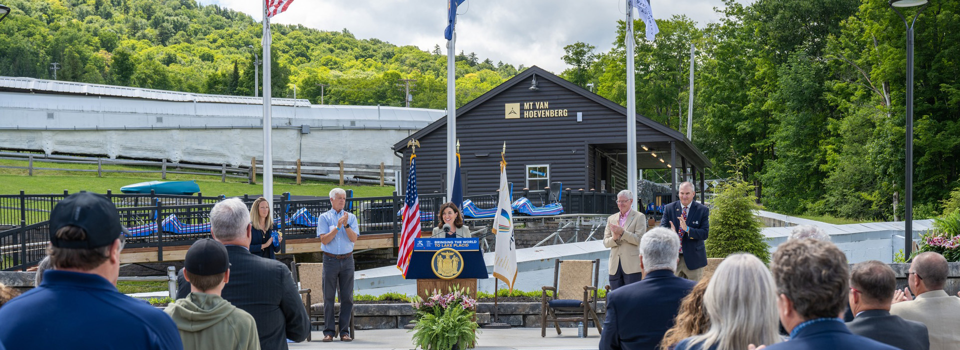 New York State Governor Kathy Hochul addresses a large audience at Mt Van Hoevenberg in Lake Placid