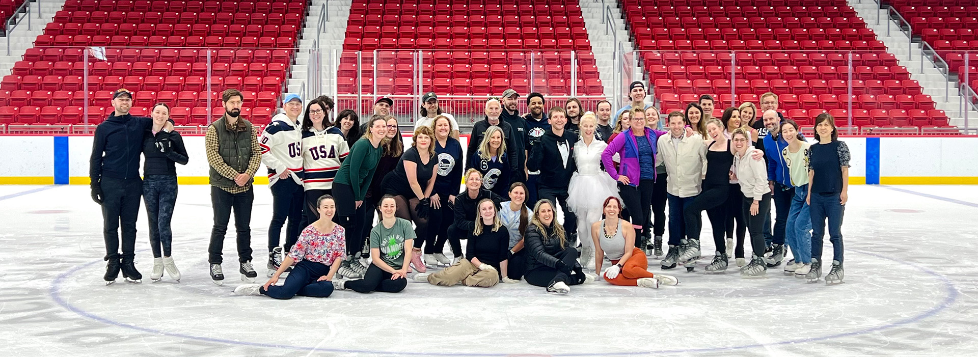 Attendees of the Andrea Bergeron Denis Shahvorostov wedding in Lake Placid, all together on the ice in the Olympic Center's 1980 Herb Brooks Arena.