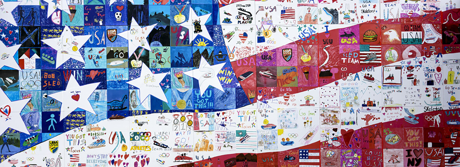 Partial image of a large mural composed of many small drawings by youth that together form an image of the U.S. flag.