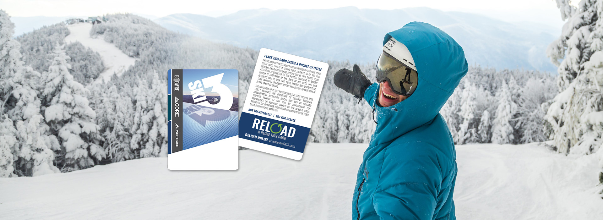 A happy skier high on the mountain in winter with arms outstreached and season passes floating in the air in front of them.