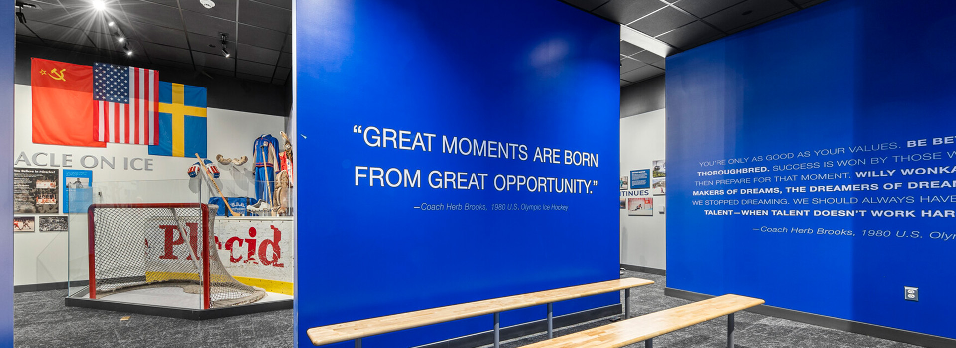 View of the museum's 1980 Miracle On Ice Exhibit shot from inside the film preview room with the quote front and center "Great moments are born from great opportunity."