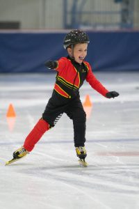 One of Henry's Kids on the short track in the 1932 Jack Shea Arena smiling and enjoying his time on the ice. 