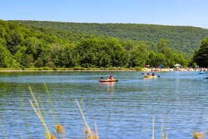 A view of Belleayre Beach and its beach goers from across the lake. 