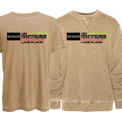 Three products with UCI Mountain Bike World Series logos, including (from left) a bike bottle, T-shirt and sweatshirt, and a hat with brim, all on a white background.