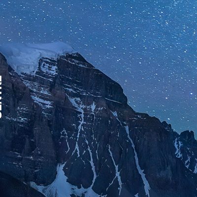 Dark silhouette like image of mountains and a climber with the title, "Banff Mountain Film Festival World Tour"