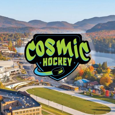 An aerial view of the Olympic Center and Lake Placid in Autumn with the black and bright green Cosmic Hockey logo in the center.