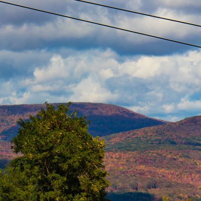 The Catskill Thunder Gondola rises into the air over the fall landscape at Belleayre Mountain